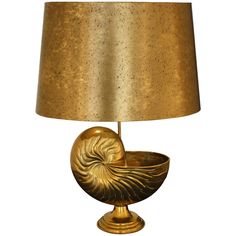 a lamp with a gold shell on it