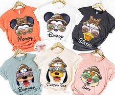 four t - shirts with cartoon characters on them, one is wearing sunglasses and the other has