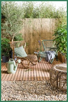 a wooden deck with chairs and potted plants