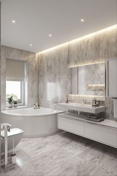 a large bathroom with marble walls and flooring