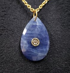 1. Sapphire, Rose Cut Diamond 18k Gold Pendant 2. Made to Order 3. Gemstone - Sapphire and Diamond  4. Jewelry Type - Pendant 5. Gold Purity - 18k 6. Pendant Bail Outer Side Size - 7 mm 7. Cut - Rose 8. Total Gram Weight - 3.640 Grams 9. Sapphire Weight - 17.08 Carat 10. Gold  Weight - 0.200 Gram 11. Diamond Weight - 0.12 Carat 12. Sapphire Size - 17 x 26.50 MM 13. Ready to dispatch in 1 - 2 days. 14. Handmade Items 15. AAA Quality Pendant 16. 1 Quantity Available   Pictures are taken under natu Formal Blue Necklace With Rose Cut Diamonds, Blue Rose Cut Diamond Pendant Jewelry, Blue Rose Cut Diamond Pendant Necklace, Blue Rose Cut Diamond Necklaces For Weddings, Blue Rose Cut Diamond Necklace For Weddings, Blue Pendant Necklaces With Rose Cut Diamonds, Blue Rose Cut Diamond Wedding Necklace, Blue Pear-shaped Rose Cut Diamond Jewelry, Blue Jewelry With Rose Cut Diamonds As Gift