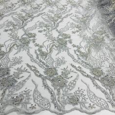 Dress up your special occasion with Lace USA's Beaded Lace Fabric Embroidered on 100% Polyester Net Mesh. This high-end, elegant fabric is perfect for making timeless beautiful couture lace pieces. Create a one-of-a-kind bridal lace, evening dress lace, quinceanera dress lace, or dance costume lace with decorative lace, beaded lace, and embellished lace crafted from this luxurious fabric. Showcase your creativity with our wedding dress lace and formal dress lace to make a statement that will las Formal Dress Lace, Quinceanera Crown, Dresses Dance, For Wedding Dresses, Lace Crafts, Beaded Lace Fabric, Elegant Fabric, Embroidered Lace Fabric, Lace Formal Dress