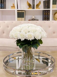 "MORE INSPIRATIONS: https://flovery.com This beautiful faux floral arrangement features many many white real touch roses and it's perfect for home decor, wedding centerpiece, business front office or event use. The roses look like they are hand-picked from the garden and arranged carefully in this square glass vase. Faux water (acrylic water) is added to keep the arrangement in place but also added realism to the design. Height: 14.5\" Width: 13\" HANDCRAFTED IN USA With Love by 30+ years experi Dining Centerpiece, Square Glass Vase, Rose Floral Arrangements, White Floral Arrangements, Large Flower Arrangements, Faux Floral Arrangement, Roses Flower, Glass Flower Vases, Home Decor Wedding