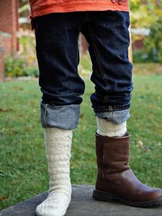 A long, warm, cozy pair of socks is everyone’s favorite once the fall winds begin to howl and this playfully textured pair in five sizes (XS/S/M/L/XL) is a delicious example. Worked from top cuff to toes, the easy to master knit/purl pattern is framed by a cable along each side. These boot socks work up speedily in a light, lofty sport weight yarn; the sporty, unisex design, flap heel, and multiple sizing make them a great gift pick