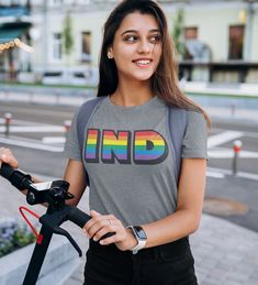 Indiana PRIDE. This classic style tee features IND filled with a rainbow print, in honor of LGBT Pride! An Incredibly soft, flattering, and comfortable shirt. Available as a women's fitted tee and tank top. SIZES Available: WOMENS XS-3X. See sizing chart in photos. FABRIC is 100% combed and ring-spun cotton Thanks for looking! We'd love to see you wearing or displaying #tribeandtrade. Add the tag so we can see! More of US:: @tribeandtrade on Instagram & Facebook Ladies Tshirt, Rainbow Tee, Pride Gifts, Fitted Tee, Lgbtq Pride, Rainbow Print, Lgbt Pride, Pride Month, Pride Shirts