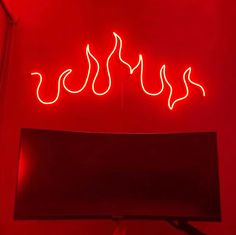 a red neon sign that says hot dogs on it