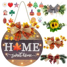 a wooden sign that says home sweet home surrounded by fall decorations