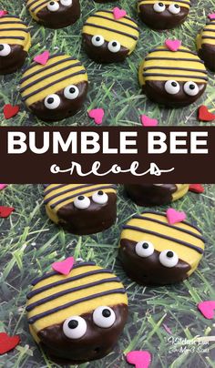 chocolate covered bumble bee oreos with eyes and hearts in the grass for valentine's day