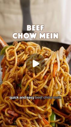 beef chow mein in a wok being served with chopsticks