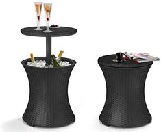 two brown wicker side tables with champagne glasses on top and magazines in the bottom