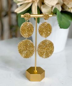 Introducing our enchanting "Dress Me Up" Earrings – a captivating accessory designed to add a touch of elegance and flair to any ensemble. These exquisite earrings feature a three-tier bead disk design that embodies a perfect balance of sophistication and style. Crafted with meticulous attention to detail, these earrings are adorned with delicate gold seed beads that shimmer and catch the light, making them a must-have addition to your jewelry collection.
Each earring is thoughtfully craft Gold Nickel-free Beaded Earrings For Party, Beaded Round Chandelier Earrings For Parties, Elegant Beaded Circle Earrings, Gold Beaded Chandelier Earrings, Gold Beaded Round Chandelier Earrings, Gold Beaded Circle Earrings, Round Metal Beaded Earrings For Party, Gold Beaded Round Metal Earrings, Party Metal Beaded Round Earrings