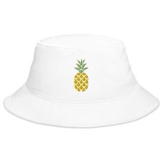 Happy Pineapple Embroidered Bucket Hat, keep the sun out of your eyes with this 100% cotton twill bucket hat. Cotton fabric and sewn eyelets are sure to help you stay cool during any activity, be it a stroll in the park or an intense game of sports. Also available and most frequently bought together! • 100% cotton twill • 2.25” brim • 3.75” crown • One size fits all • Sewn eyelets for breathability Fun White Cotton Sun Hat, White Cotton Visor Bucket Hat, White Canvas Summer Hat, Fun Cotton Bucket Hat For Vacation, Fun Cotton Summer Bucket Hat, Fun Summer Cotton Bucket Hat, White Cotton Bucket Hat For Vacation, Embroidered Bucket Hat, Bucket Hat White