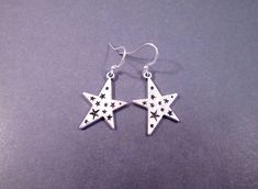 Silver star pendants (22x30mm) with etched star design, on french hook ear wires. These earrings measure one and 3/4 inches in length.... See more of my designs here: justEARRINGS.etsy.com And please visit my sister~shops; justCHARMING.etsy.com & BohoDreamJewelry.etsy.com All of my jewelry shops offer FREE SHIPPING! Highlights: handmade jewelry, star earrings, etched design, silver pendants, french hook ear wires, women fashion gift, free shipping Jewelry Star, Etched Designs, Silver Dangle Earrings, Star Design, Silver Pendants, Design Silver, Silver Earrings Dangle, Star Pendant, Silver Stars