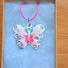 Handmade Pink Crystal Butterfly Necklace Made With Enamel Butterfly On Pink Cord Chain. Pendant Butterfly Measures 28mm In Shining Plated Silver. Pendant Features Enamel Pink Shades With Pink Crystal Stones. The Butterfly Is A Symbol Of Endurance And Hope. Chain Is Adjustable With Claw Clasp Closure. Box Display Only. Pouch Included Free. New And Unused Item. Contact Me With Any Offers. Crystal Butterfly Necklace, Pendant Butterfly, Enamel Butterfly, Box Display, Pink Shades, Crystal Butterfly, Crystal Stones, Butterfly Necklace, The Butterfly