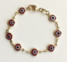 "18k gold filled red evil eye bracelet for good luck, prosperity and protection. 5,5\" long for baby. pulsera de ojo de la buena suerte en 18k gold filled para prosperidad,buena suerte y poteccion. bebe 5,5\"largo." Evil Eye Bracelet For Baby, Red Evil Eye Bracelet, Red Evil Eye, Figaro Necklace, Baby 5, Good Luck Bracelet, Baby Bracelet, For Good Luck, Protection Bracelet