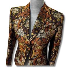 Elevate your wardrobe with this rare Richard Tyler brocade blazer, a stunning silk gold jacquard piece that radiates luxury and sophistication. Perfect for making a statement at any event, this vintage designer blazer is not just a garment but a true reflection of timeless elegance--grab yours today and let your style shine! Rare Find! Beautiful silk metallic brocade blazer by designer Richard Tyler 'Collection' Brown and gold silk jacquard blazer Shoulders are lightly padded, the sleeves are fi Formal Blazer With Floral Print, Elegant Formal Blazer With Floral Print, Jacquard Long Sleeve Blazer For Parties, Jacquard Long Sleeve Party Blazer, Jacquard Party Blazer, Elegant Formal Outerwear With Floral Print, Formal Silk Blazer With Floral Print, Formal Fall Floral Print Blazer, Formal Gold Silk Outerwear