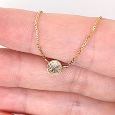 Elevate your style with this luxurious yet minimalist solitaire diamond necklace. Crafted with a 5mm round cut diamond, bezel set in solid 14k white, yellow or rose gold. A perfect accent to your everyday wear and perfect for April birthdays. Enjoy the beauty of natural diamonds! Choose between a 16" and 18" chain so we can make sure your pendant is perfectly centered! Minimalist Solitaire Necklace With Bezel Setting As Gift, Minimalist Solitaire Round Diamond Necklace, Everyday Round Birthstone Necklace With Single Diamond, Minimalist Round Solitaire Diamond Necklace, Minimalist Birthstone Necklace For Anniversary, 14k Gold Solitaire Necklace With Bezel Setting For Anniversary, Minimalist Bezel Set Diamond Necklace For Anniversary, Minimalist Solitaire Necklace With Bezel Setting For Anniversary, Modern Bezel Set Diamond Necklace As Gift