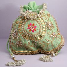 "Beautiful Golden Ribbon Cut Work Thread Embroidered Beaded Indian Traditional Wedding Potli Bags Bridemaids Gift Handbag Material: Organza, Golden Ribbon, Golden Tread, Golden Sequins, Motifs Package Contents: As per quantity purchased Size: 10\" x 8\" Designed with the heart, this beautiful Potli or batawa bag are eye catchy and made of premium material. Key Features: Embroidery art work This potli is good match with both Indian and western outfits and are superb for wedding and festive partie Elegant Beaded Pouch For Wedding, Rectangular Beaded Potli Bag For Wedding, Traditional Green Beaded Bag, Traditional Green Beaded Bags, Festive Beaded Shoulder Bag For Wedding, Elegant Green Shoulder Bag For Wedding, Elegant Green Wedding Shoulder Bag, Green Handwork Rectangular Bag, Green Bag With Zari Work For Wedding