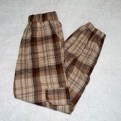 Never Worn Brown Plaid Pants With Pockets Brown Trousers With Elastic Waistband, Casual Brown High-waisted Pants, Brown Pants With Elastic Waistband For Fall, Brown Tapered Leg Bottoms For Fall, Neutral Tapered Leg Bottoms For Fall, Trendy Brown Pants With Elastic Waistband, Casual Beige Pants For Fall, Casual Beige Fall Pants, Beige Pants With Elastic Waistband For Fall