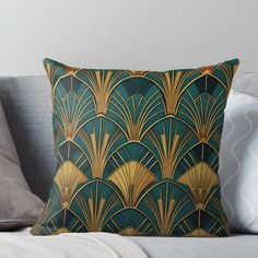 a green and gold art deco design throw pillow