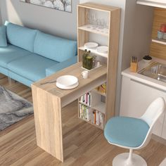 a living room with a blue couch and white chair next to a kitchen counter top