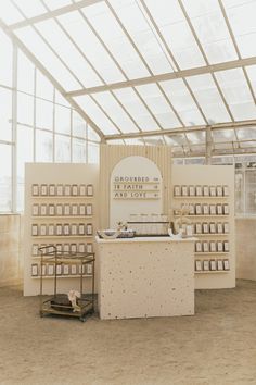 the interior of a building with several shelves and boxes on display in front of it