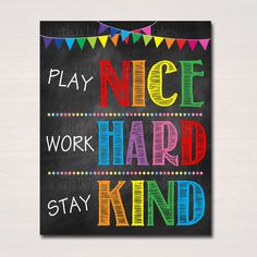 a chalkboard sign that says, play nice work hard stay kind