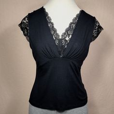 Black Sleeveless Blouse With Lace Details Nwot Soft, Sexy And Elegant Size: Small Petite Color: Black 95% Rayon 5% Spandex Fitted Black Camisole Top, Elegant Black Camisole Blouse, Elegant Black Tops With Built-in Bra, Stretch Lace Top Camisole For Night Out, Black Stretch Sleeveless Blouse, Black Fitted Tank Top For Evening, Black Fitted V-neck Camisole, Elegant Black Fitted Tank Top, Fitted Black Tank Top With Lace Detail