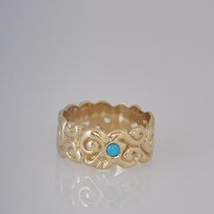 "This wide wedding band is 14k gold. It is very impressive wedding band for a woman. This Turquoise ring is one of the first engraved rings I ever made and I am still very happy with it. A client asked me for a round Turquoise stone between the elements of this gold band and I think it came out unique and special ! :-) If you want me to make you a similar ring, let me know your size and I will make it for you, please note that according to the ring size I may need to add or remove a small portio Wide Wedding Bands, Blue Opal Ring, Handmade Wedding Rings, Solid Gold Rings, Turquoise Rings, Handmade Wedding, Engraved Rings, Turquoise Stone, Gold Bands