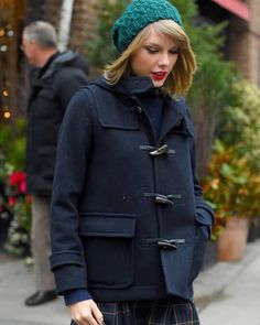 Taylor Swift Outfit Blue Coat With Hood Showcase sophistication and urban elegance with our Taylor Swift blue hooded coat, the epitome of her timeless style. Being more than just a coat, this blue wool outerwear is a must-have and the ultimate wardrobe essential for all our Swifties inspired by Taylor’s style and wishing to recreate her iconic look. Constructed using the highest quality wool, this blue coat for women offers both warmth and comfort while showcasing great attention to detail and the top-notch work of our skilled craftsmen. Being not only stylish but also practical, this wool coat features a premium viscose lining on the interior, which offers warmth and breathability. Equipped with a hood, it offers extra coverage and protection from wind and cold while further enhancing the Blue Wool Peacoat For Winter, Winter Outerwear With Adjustable Hood For Work, Navy Peacoat With Pockets For Winter, Winter Workwear Outerwear With Adjustable Hood, Blue Wool Outerwear For Winter, Classic Blue Winter Outerwear, Blue Wool Outerwear For Cold Weather, Classic Hooded Wool Coat For Winter, Classic Winter Wool Coat With Hood