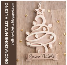 a wooden ornament with a christmas tree on it and the name baron natale