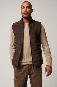 Our sporty and versatile Gavin vest is ready to take on cool-weather days. Made from soft yet durable lamb suede, this quilted leather vest is the perfect pick for fall adventures, from hiking amidst the changing leaves to taking in a Sunday football game. A classic cut with standup collar and full front zip pairs perfectly with your favorite jeans and boots, while four pockets offer space to store your keys and phone. Leather Winter Outdoor Vest, Sleeveless Outerwear For Hiking In Fall, Sleeveless Outerwear For Fall Hiking, Sleeveless Fall Outerwear For Hiking, Sleeveless Fall Hiking Outerwear, Brown Vest Outerwear For Outdoor Activities, Quilted Vest For Layering In Fall, Winter Outdoor Brown Vest, Leather Sleeveless Vest For Winter