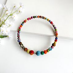 A circle of colorful textile-wrapped beads on a memory wire form this classic choker silhouette. Bead Tips, Kantha Fabric, Running Stitch, Memory Wire, Long Style, Women Artisans, Brass Metal, Metallic Accents, Fabric Scraps