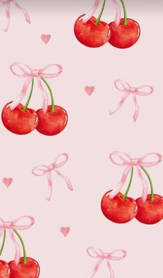 cherries with bows and hearts on a pink background