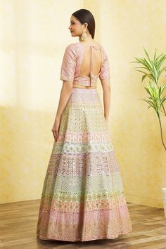 Multi colored colorblock lehenga with attached cancan, floral pattern mirror and gota work embroidery. Comes with embroidered, padded blouse and dupatta.
Component: 3
Pattern: Embroidered
Type Of Work: Mirror and Gota Work
Neckline: V-Neck
Sleeve Type: Short
Fabric: Dupion Silk
Color: Multi Color
Other Details: 
Back scoop neck blouse with tassel tie-up
Tasselled hem blouse
Semi sheer dupatta with embroidered borders
Lehenga with attached cancan
Padded blouse
Lehenga length: 42 inches
Closure:
B Multicolor Fusion Traditional Wear For Wedding, Multicolor Resham Embroidery Palazzo Set For Wedding, Fitted Multicolor Palazzo Set For Wedding, Fusion Style Multicolor Lehenga With Cutdana, Semi-stitched Multicolor Meenakari Sharara, Multicolor Palazzo Set With Zari Work For Wedding, Anarkali Style Multicolor Palazzo Set For Wedding, Multicolor Semi-stitched Meenakari Sharara, Fusion Style Multicolor Cutdana Lehenga