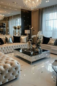 a living room filled with lots of white furniture