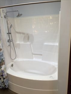 a bathroom with a bathtub and shower head