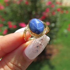 Vintage 18K Solid Yellow Gold Star Blue Sapphire Filigree Ring ....Marked 18K...Total of weights 2.7grams...Size 7.25...With 01 Oval Star Blue Sapphire 10 x 8.MM ( 2.54ct )Measure of Face 12.6MM...It's in very good condition. Blue Celestial 14k Gold Rings, Celestial Blue Cabochon Ring, Celestial Blue Oval Ring, Celestial Style Blue Oval Ring, Formal Celestial Blue Ring, Evil Eye Ring Silver, Peacock Ring, Square Diamond Rings, Star Sapphire Ring