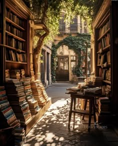 an alley way with bookshelves and tables full of books in the sun light