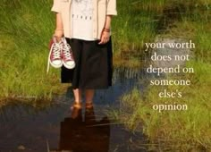 a woman is standing in the water with her shoes on, and there is a quote above it