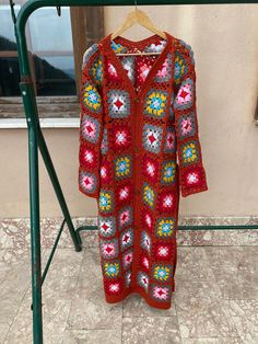 "Granny Square Cardigan, Crochet Vest for Women, Long Sleeve Cardigan, Crochet Coat, Oversized Cardigan, Floor Leght Top, Christmas Gift Her ✅ The cardigan has buttons & tie and can be used as a dress ✅Our Women's knitted Cardigan material is comfortable and warm to wear. It is soft and elastic so that it can adapt to various body types. This Ladies Cardigan is made  cotton and premium acrylic.  The Granny Square Cardigan will also make a PERFECT GIFT for your loved ones.   Each piece is one-of- Bohemian Crochet V-neck Cardigan, Bohemian V-neck Crochet Cardigan, Red Long Sleeve Cardigan For Festivals, Bohemian Red Long Sleeve Cardigan, Red Bohemian Long Sleeve Cardigan, Red Crochet Long Sleeve Outerwear, Lightweight Long Red Outerwear For Beach, Red Bohemian V-neck Outerwear, Granny Square Long Sleeve Cardigan For Festivals