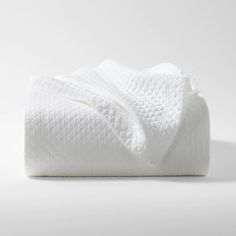 a white blanket folded on top of each other