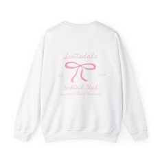 a white sweatshirt with pink lettering on it