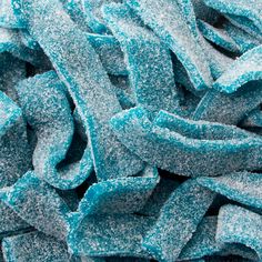 close up view of blue and silver colored sugary candies with sprinkles