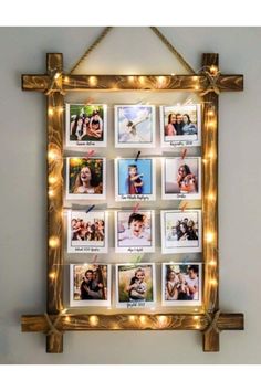 a gold frame with pictures and lights hanging from it's sides in front of a wall