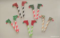 paper straws with different designs and colors are arranged in a circle on a white surface