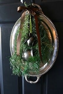 a christmas wreath hanging on the front door