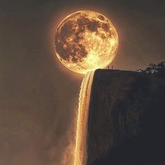 a full moon rising over a waterfall in the sky