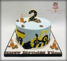 a two year old birthday cake with construction theme