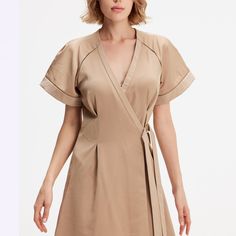 A minimalist and chic cut, this dress elegantly emphasizes any type of silhouette: fitted to the waist not a wallet system, wide raglan cuffs, V neckline and flared volume. Refined finishes with inlaid openwork braid and satin trim at the sleeves and along the neckline. A timeless cut in a soft poplin-type fabric that is easy to iron. This dress adapts to various occasions and will be a chic and safe option for your evenings or for the office. Main fabric:  100% Polyester Finishes: 65% Viscose, Size 10 Models, Tuxedo Style, Versatile Outfits, Men's Watches, Blazer Dress, Independent Designers Fashion, Wrist Watches, Flare Skirt, White Silver